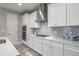 Bright kitchen features white cabinetry, stainless steel appliances, and countertop with decor accents at 12652 Shetland Walk Dr, Lithia, FL 33547