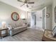 Relaxing room with double glass doors, a comfortable sofa, and views into the entryway at 12652 Shetland Walk Dr, Lithia, FL 33547