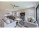 Inviting living room with stylish decor, neutral furnishings, and a view into the dining area at 12652 Shetland Walk Dr, Lithia, FL 33547