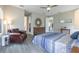 Bright main bedroom with hardwood floors, ceiling fan, walk-in closet and natural light at 12652 Shetland Walk Dr, Lithia, FL 33547