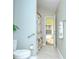 Bright bathroom featuring a shower, vanity with granite top, and palm-themed decor at 13602 Fawn Ridge Blvd, Tampa, FL 33626