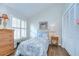 Comfortable bedroom with a charming bed, window with shutters, closet, and neutral decor at 13602 Fawn Ridge Blvd, Tampa, FL 33626
