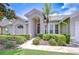 Charming home featuring a beautifully landscaped yard and inviting stone pathway leading to the front door at 13602 Fawn Ridge Blvd, Tampa, FL 33626