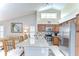 Bright kitchen features granite countertops, stainless steel appliances and a breakfast bar with seating at 13602 Fawn Ridge Blvd, Tampa, FL 33626