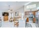 Open-concept kitchen with granite countertops, stainless steel appliances and seating at the breakfast bar at 13602 Fawn Ridge Blvd, Tampa, FL 33626