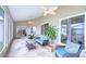 Spacious screened lanai with outdoor seating, ceiling fans, and views of the backyard at 13602 Fawn Ridge Blvd, Tampa, FL 33626