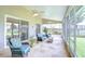 Screened lanai with ample seating and ceiling fans provides a relaxing outdoor space at 13602 Fawn Ridge Blvd, Tampa, FL 33626