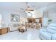 Living room open to kitchen and dining room, features vaulted ceilings and abundant natural light at 13602 Fawn Ridge Blvd, Tampa, FL 33626