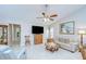 Living room features neutral paint, tile floors, and a ceiling fan for added comfort at 13602 Fawn Ridge Blvd, Tampa, FL 33626