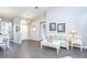 Bright living area with light walls, a vaulted ceiling, and views through sliding glass doors at 13602 Fawn Ridge Blvd, Tampa, FL 33626
