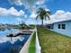 Backyard view with access to private dock and canal at 13931 King Ave, Hudson, FL 34667