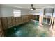 Spacious living room with a ceiling fan ready for remodeling at 13931 King Ave, Hudson, FL 34667