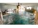 Spacious open living room under renovation with ceiling fan at 13931 King Ave, Hudson, FL 34667