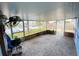 Enclosed patio with view of canal and outdoor space at 13931 King Ave, Hudson, FL 34667