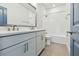 Bathroom with double vanity, shower over tub, and tile flooring at 1583 Running Tide Pl, Sarasota, FL 34240