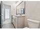 Bathroom featuring double vanity, white cabinets, and tile flooring at 1583 Running Tide Pl, Sarasota, FL 34240