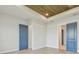 Spacious bedroom with attractive wood ceiling and stylish blue doors at 1583 Running Tide Pl, Sarasota, FL 34240