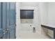 Laundry room offers overhead cabinets, counter space, and convenient utility connections at 1583 Running Tide Pl, Sarasota, FL 34240