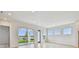 Bright living room with sliding doors and lake views at 1583 Running Tide Pl, Sarasota, FL 34240