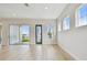 Bright living room with sliding doors and lake views at 1583 Running Tide Pl, Sarasota, FL 34240