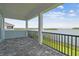 Covered patio with brick pavers and scenic lake views at 1583 Running Tide Pl, Sarasota, FL 34240