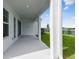 Covered patio has white concrete flooring, access to a fenced yard and water views at 1583 Running Tide Pl, Sarasota, FL 34240