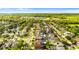 An aerial shot showcases the neighborhood, highlighting the homes and community amenities at 1631 Shady Oaks Dr, Oldsmar, FL 34677