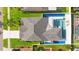 Overhead view of home, highlighting the private backyard oasis complete with a sparkling swimming pool at 1631 Shady Oaks Dr, Oldsmar, FL 34677