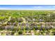 Expansive aerial view of a single-Gathering home nestled in a lush, green neighborhood at 1631 Shady Oaks Dr, Oldsmar, FL 34677