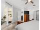 Bedroom with access to backyard, featuring a ceiling fan and sliding glass door at 1631 Shady Oaks Dr, Oldsmar, FL 34677