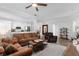 Spacious living area featuring an open layout with views of the kitchen and stylish furnishings at 1631 Shady Oaks Dr, Oldsmar, FL 34677