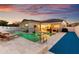 Expansive backyard featuring a sparkling pool, ample seating areas, and meticulous landscaping at 1631 Shady Oaks Dr, Oldsmar, FL 34677