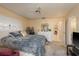 Inviting bedroom with a comfortable bed, carpet, and soft lighting at 1712 Hammock Pine Blvd # 1712, Clearwater, FL 33761