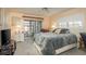 Comfortable bedroom with a view to the outdoor patio, soft lighting, and neutral colors at 1712 Hammock Pine Blvd # 1712, Clearwater, FL 33761
