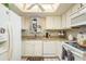 Functional kitchen with white appliances, ample storage, and practical layout at 1712 Hammock Pine Blvd # 1712, Clearwater, FL 33761