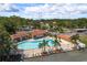 Community pool area with a hot tub, cabana, and lounge chairs at 1712 Hammock Pine Blvd # 1712, Clearwater, FL 33761