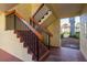 Exterior staircase with metal railings and view of lush greenery at 1712 Hammock Pine Blvd # 1712, Clearwater, FL 33761