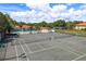 Aerial view of the community tennis courts on a sunny day at 1712 Hammock Pine Blvd # 1712, Clearwater, FL 33761