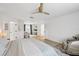 Bright bedroom showcasing multiple entry ways, a massage chair and natural light at 1802 Regal Mist Loop, Trinity, FL 34655