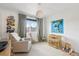 Bedroom room with natural lighting, crib, and decor at 1802 Regal Mist Loop, Trinity, FL 34655