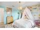 Charming bedroom featuring unique canopy bed, wood dresser and whimsical décor at 1802 Regal Mist Loop, Trinity, FL 34655