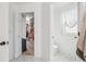 View of closet and toilet room with white walls at 1802 Regal Mist Loop, Trinity, FL 34655