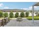 Enjoy cozy evenings by the stone fire pit, with views of the screened pool at 1802 Regal Mist Loop, Trinity, FL 34655