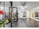 Fully-equipped home gym with free weights, turf strips, and padded floors at 1802 Regal Mist Loop, Trinity, FL 34655