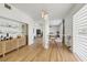 Hallway showcases hardwood floors and glass rack with bar, and a cozy seating area at 1802 Regal Mist Loop, Trinity, FL 34655