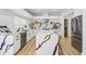 Modern kitchen with white quartz countertops, stainless steel appliances, and a center island with seating at 1802 Regal Mist Loop, Trinity, FL 34655