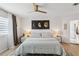 Spacious primary bedroom with a ceiling fan, wood floors, and natural light at 1802 Regal Mist Loop, Trinity, FL 34655
