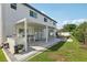 Outdoor kitchen and entertaining space on the back of this home at 1802 Regal Mist Loop, Trinity, FL 34655