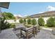 Relax on this patio with comfortable seating and a tranquil view of the fenced backyard at 1802 Regal Mist Loop, Trinity, FL 34655