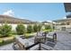 Outdoor patio with comfortable seating and a beautiful manicured lawn at 1802 Regal Mist Loop, Trinity, FL 34655